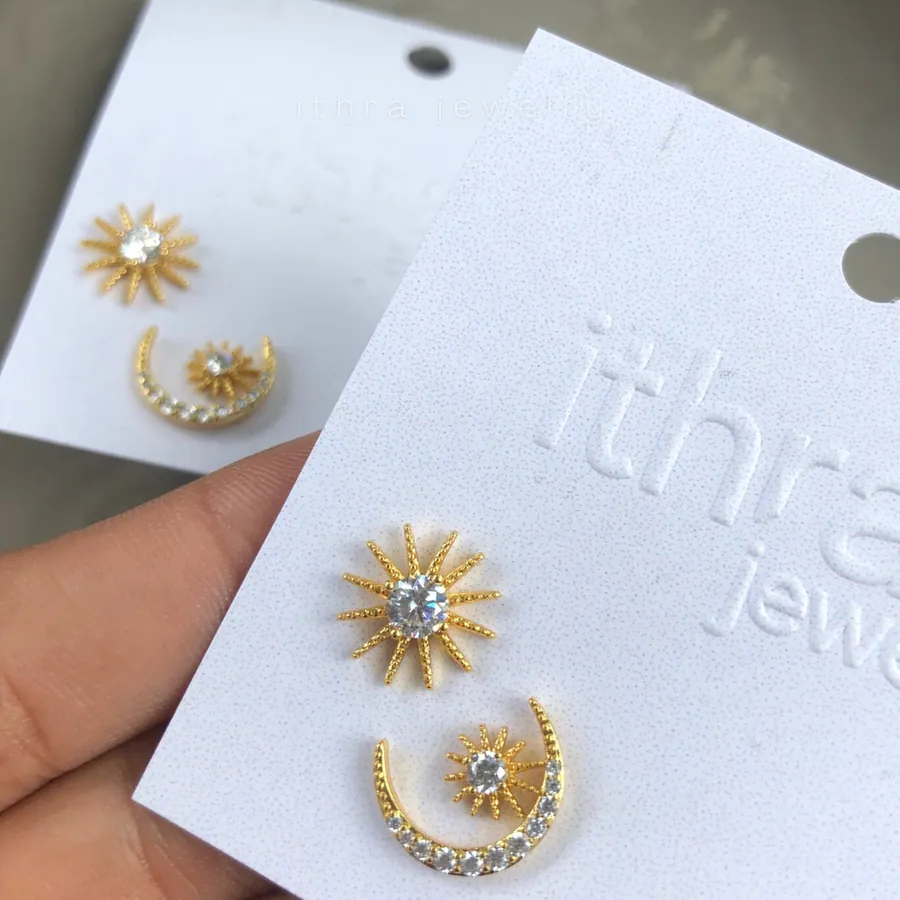 Sun and moon studs on an ITHRA card